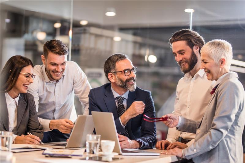 ACTICO keyvisual of people working together and smiling