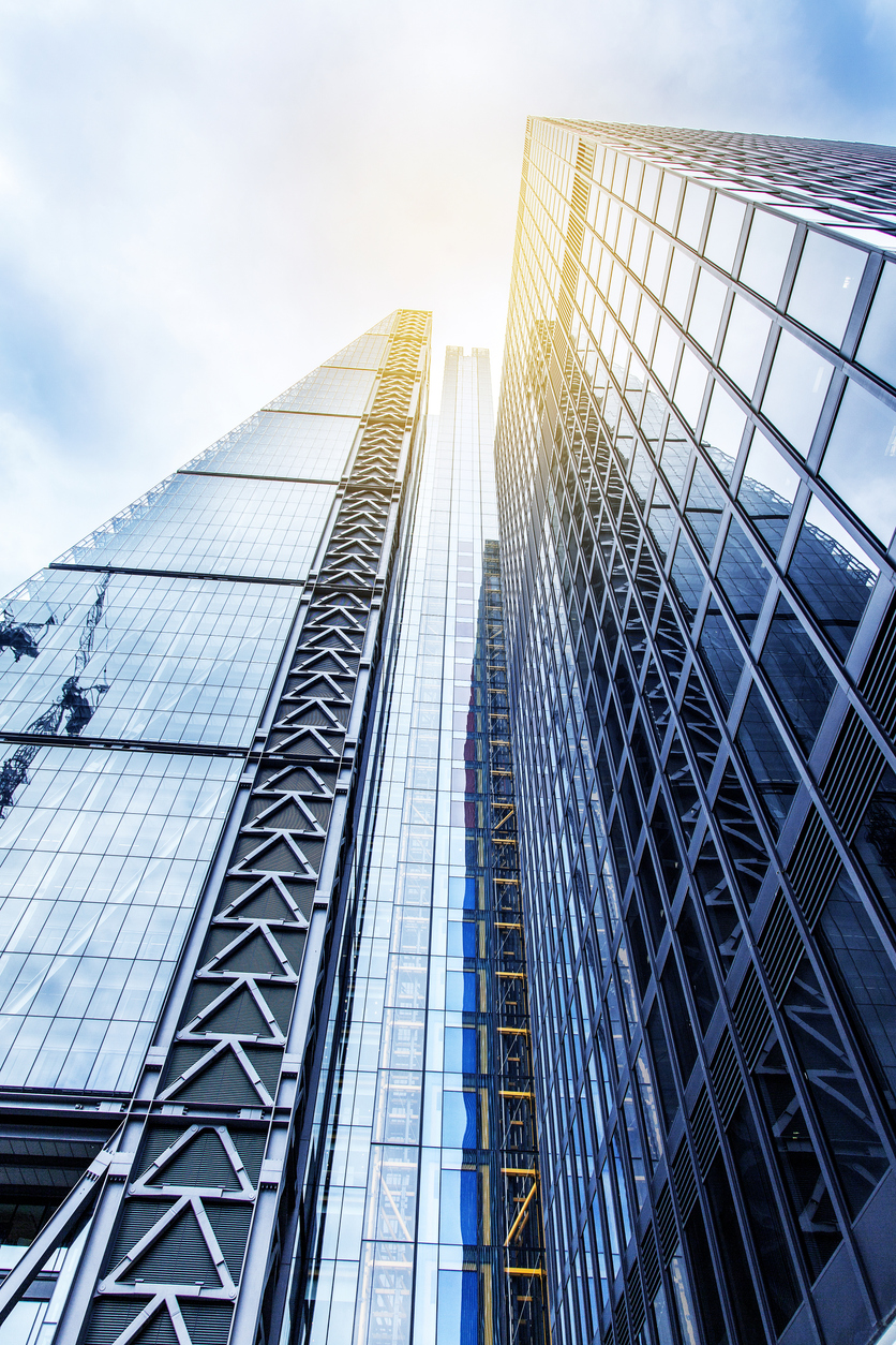 Modern glass silhouettes of skyscrapers at day time